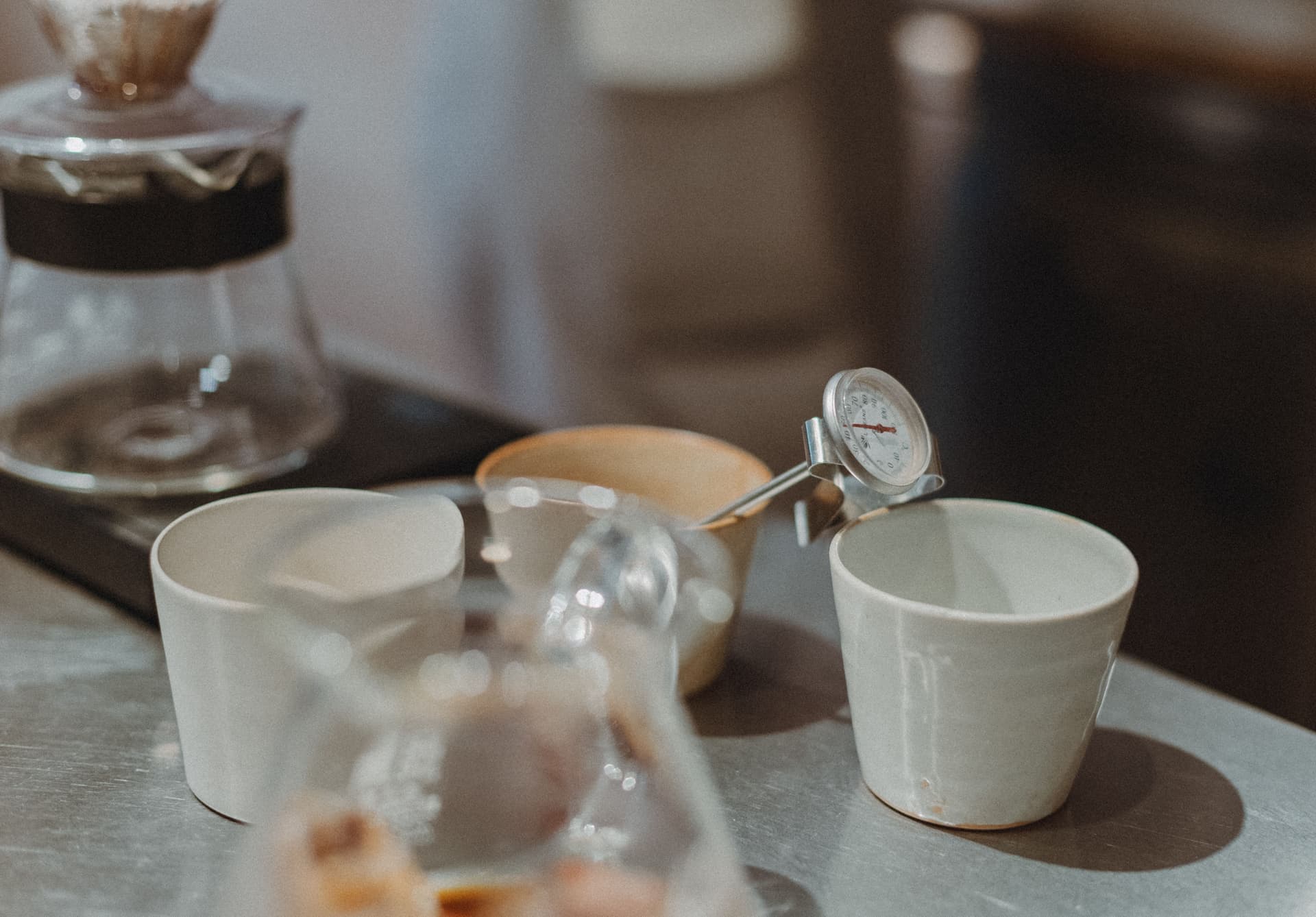 A thermometer measuring hot water for brewing tea