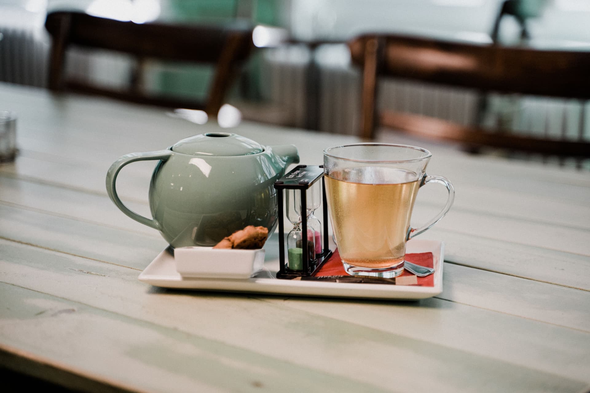 A timer beside a steeping cup of tea