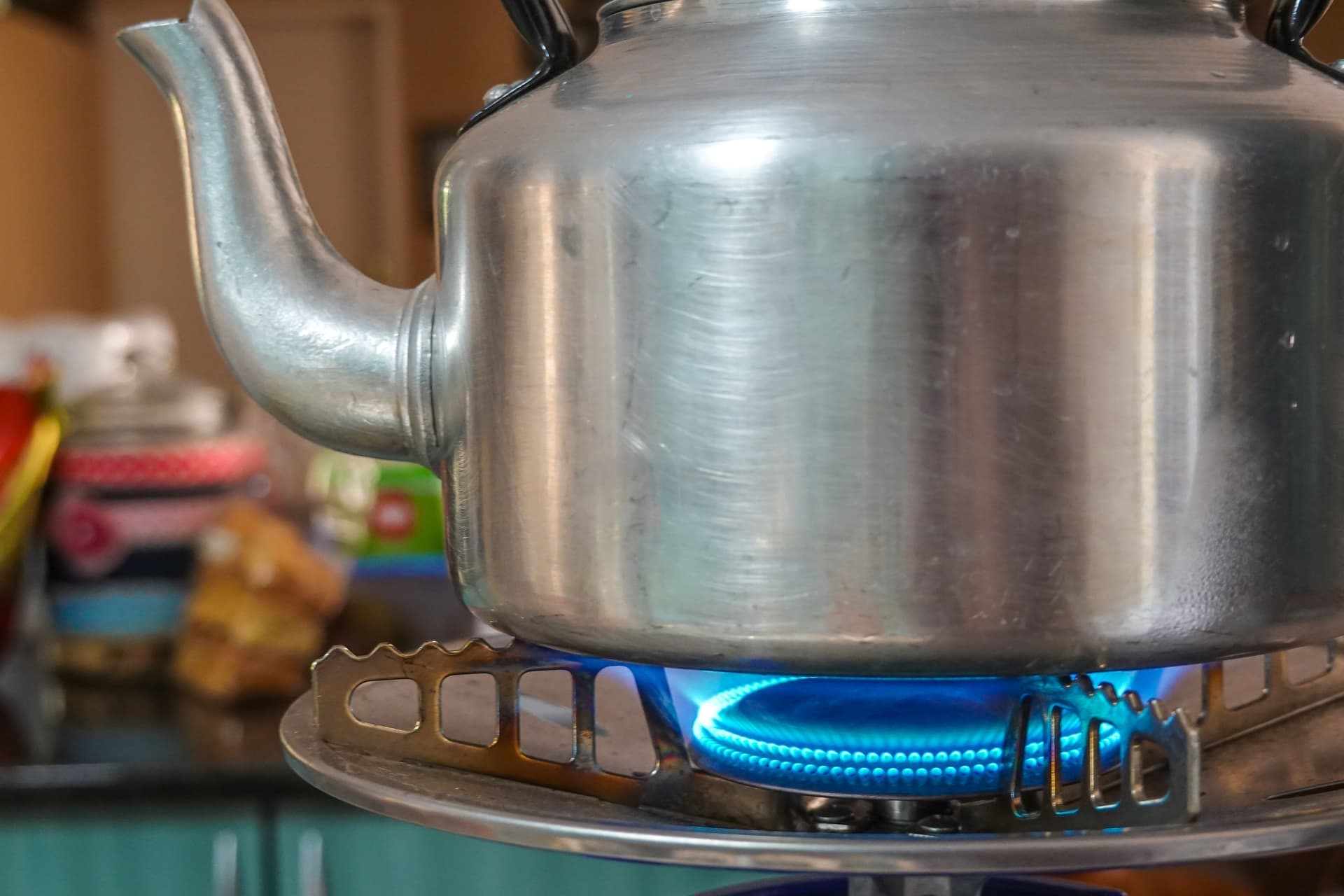 A stovetop kettle heating on a gas hob