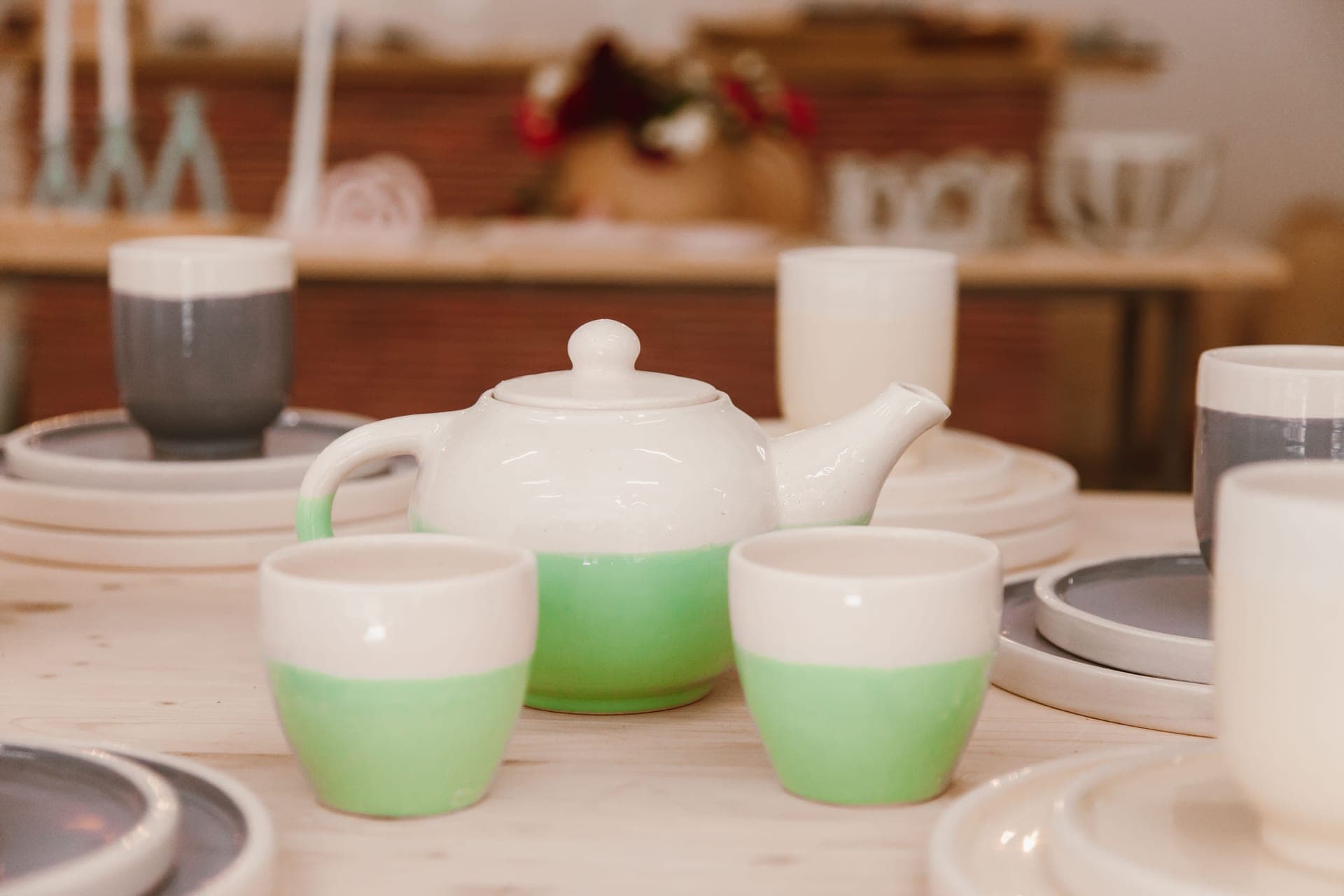 A teapot and a mug with an infuser side by side